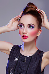 Image showing Beautiful girl with hairdo and bright make-up