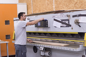 Image showing worker in a factory of wooden furniture