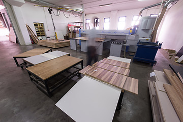 Image showing worker in a factory of wooden furniture