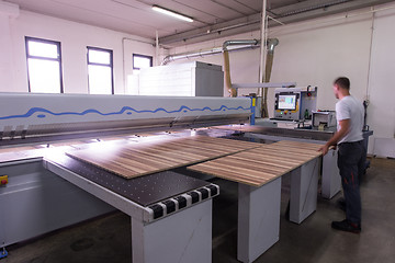 Image showing worker in a factory of wooden furniture