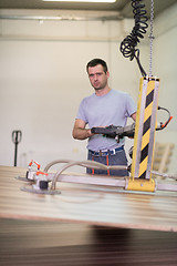 Image showing worker in a factory of wooden furniture