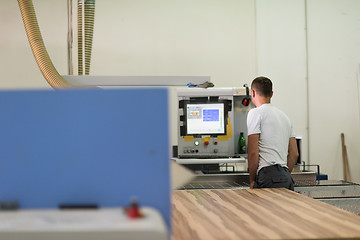 Image showing worker in a factory of wooden furniture