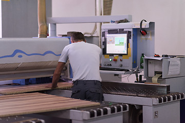 Image showing worker in a factory of wooden furniture