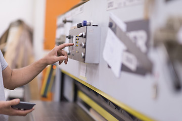 Image showing worker in a factory of wooden furniture