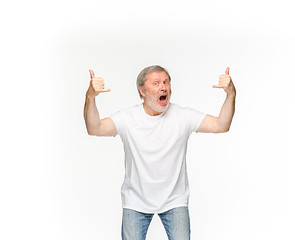 Image showing Closeup of senior man\'s body in empty white t-shirt isolated on white background. Mock up for disign concept