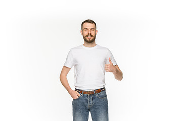 Image showing Closeup of young man\'s body in empty white t-shirt isolated on white background. Mock up for disign concept