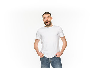 Image showing Closeup of young man\'s body in empty white t-shirt isolated on white background. Mock up for disign concept