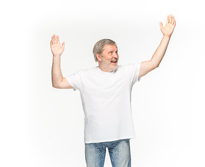 Image showing Closeup of senior man\'s body in empty white t-shirt isolated on white background. Mock up for disign concept