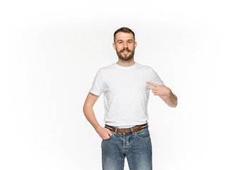 Image showing Closeup of young man\'s body in empty white t-shirt isolated on white background. Mock up for disign concept