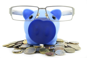 Image showing Blue piggybank with coins