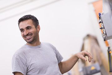 Image showing worker in a factory of wooden furniture