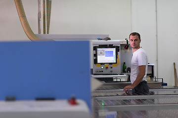 Image showing worker in a factory of wooden furniture