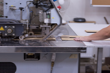 Image showing engineer in front of wood cutting machine