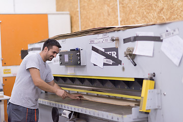 Image showing worker in a factory of wooden furniture