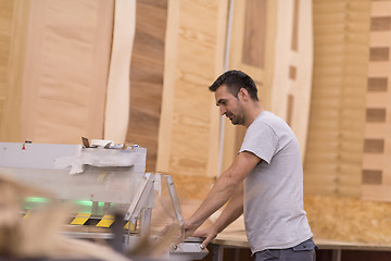 Image showing worker in a factory of wooden furniture