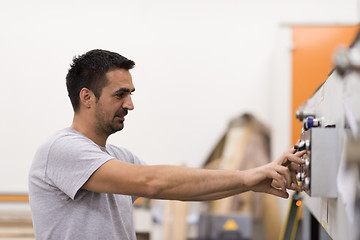 Image showing worker in a factory of wooden furniture