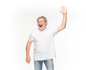 Image showing Closeup of senior man\'s body in empty white t-shirt isolated on white background. Mock up for disign concept