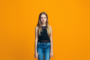 Image showing Young serious thoughtful teen girl. Doubt concept.