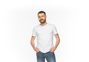 Image showing Closeup of young man\'s body in empty white t-shirt isolated on white background. Mock up for disign concept