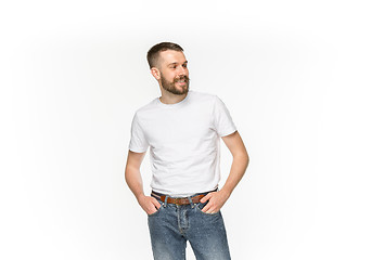 Image showing Closeup of young man\'s body in empty white t-shirt isolated on white background. Mock up for disign concept