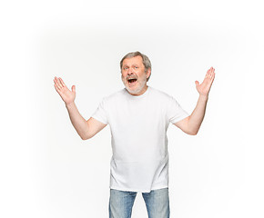 Image showing Closeup of senior man\'s body in empty white t-shirt isolated on white background. Mock up for disign concept