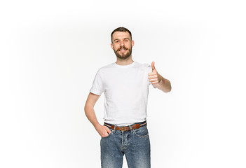 Image showing Closeup of young man\'s body in empty white t-shirt isolated on white background. Mock up for disign concept