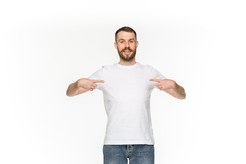 Image showing Closeup of young man\'s body in empty white t-shirt isolated on white background. Mock up for disign concept