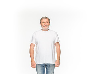 Image showing Closeup of senior man\'s body in empty white t-shirt isolated on white background. Mock up for disign concept