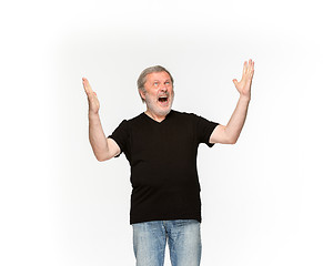 Image showing Closeup of senior man\'s body in empty black t-shirt isolated on white background. Mock up for disign concept