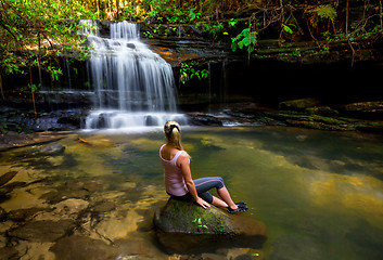 Image showing Woman at waterfall and swimming hole in bushland wilderness