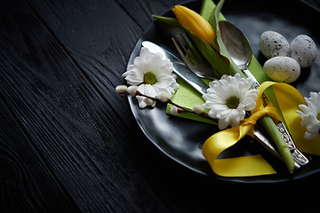 Image showing Easter spring table dishware composition with yellow tulip flower