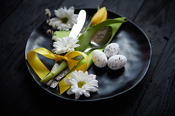 Image showing Easter spring table dishware composition with yellow tulip flower