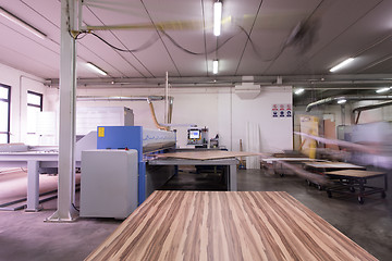 Image showing worker in a factory of wooden furniture