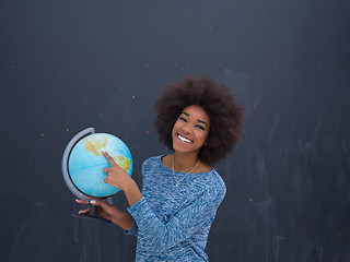 Image showing black woman holding Globe of the world