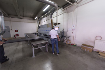 Image showing workers in a factory of wooden furniture