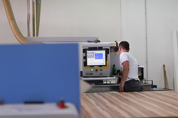 Image showing worker in a factory of wooden furniture