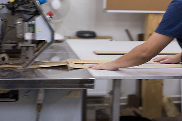 Image showing engineer in front of wood cutting machine