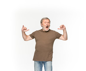 Image showing Closeup of senior man\'s body in empty brown t-shirt isolated on white background. Mock up for disign concept