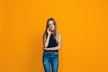 Image showing Young serious thoughtful teen girl. Doubt concept.