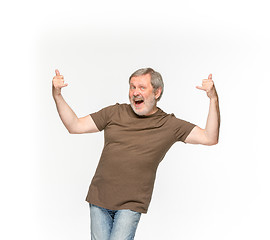 Image showing Closeup of senior man\'s body in empty brown t-shirt isolated on white background. Mock up for disign concept