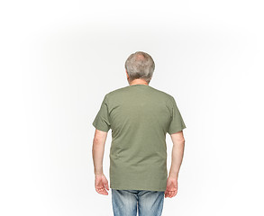 Image showing Closeup of senior man\'s body in empty green t-shirt isolated on white background. Mock up for disign concept