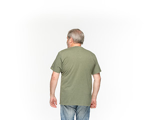 Image showing Closeup of senior man\'s body in empty green t-shirt isolated on white background. Mock up for disign concept