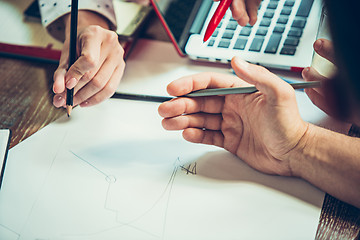 Image showing The hands of people working at office