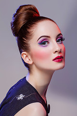 Image showing Beautiful girl with hairdo and bright make-up