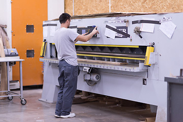 Image showing worker in a factory of wooden furniture