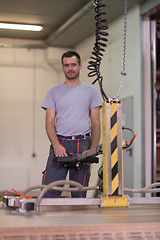 Image showing worker in a factory of wooden furniture