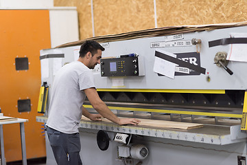 Image showing worker in a factory of wooden furniture