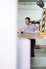 Image showing worker in a factory of wooden furniture