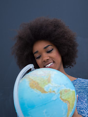 Image showing black woman holding Globe of the world