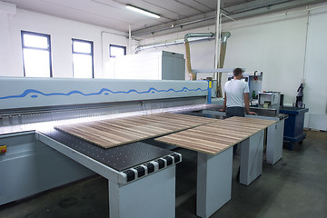 Image showing worker in a factory of wooden furniture